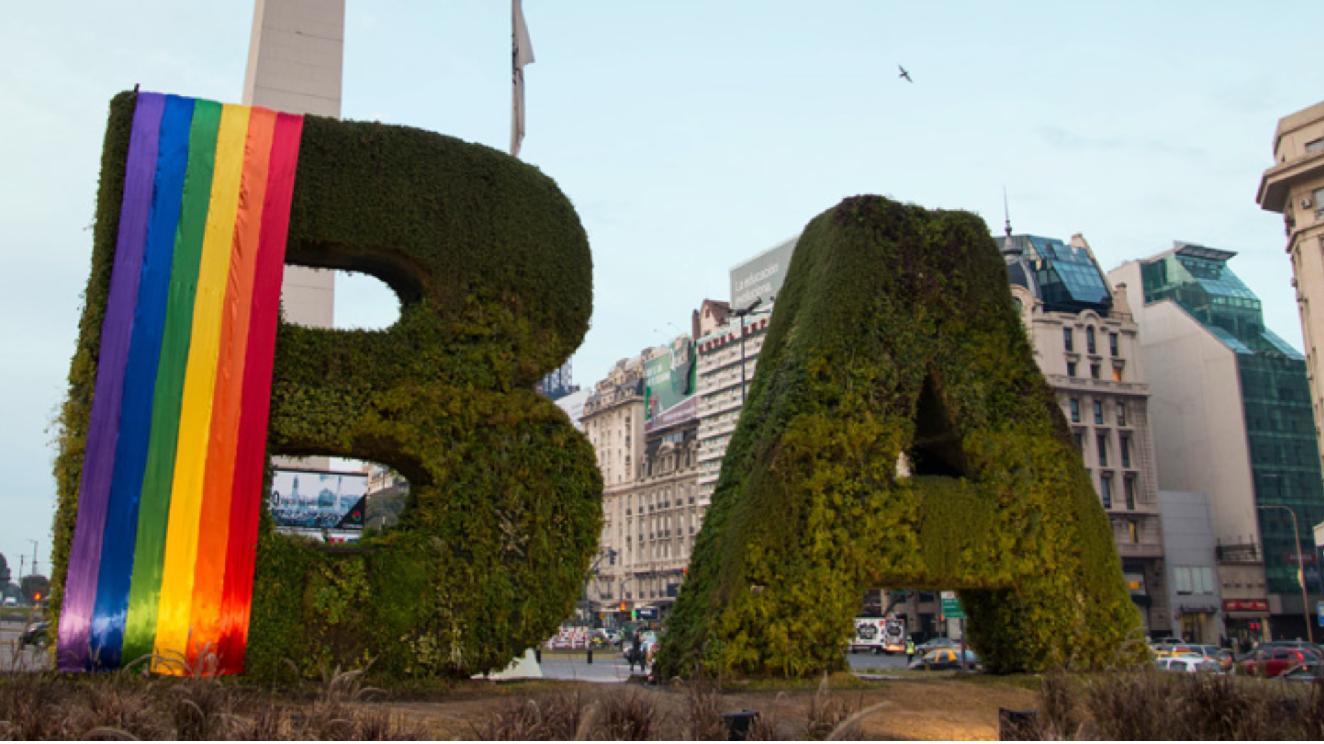 BA letters with pride colors next to the Obelisk of Buenos Aires.