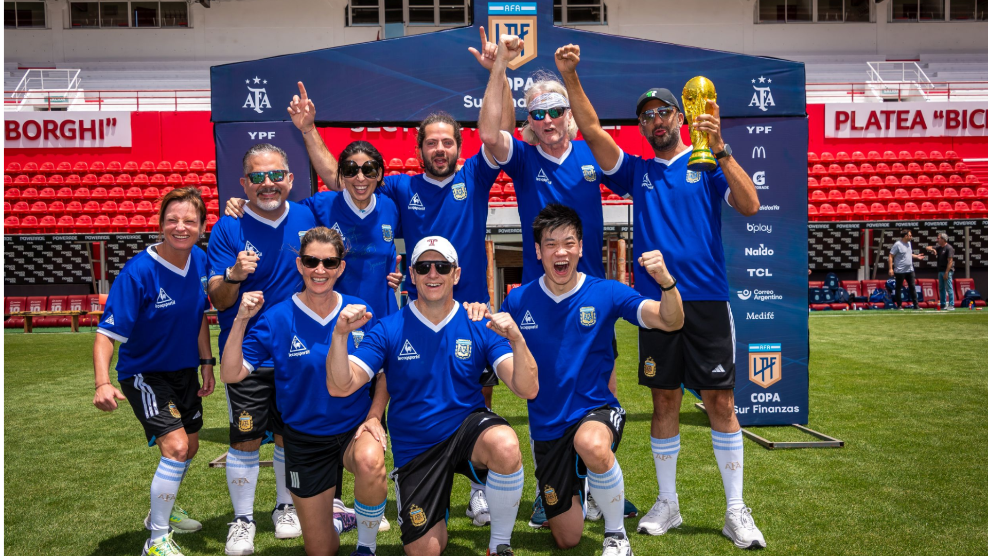 Participants celebrate a football experience at the Argentinos Juniors stadium in Buenos Aires.