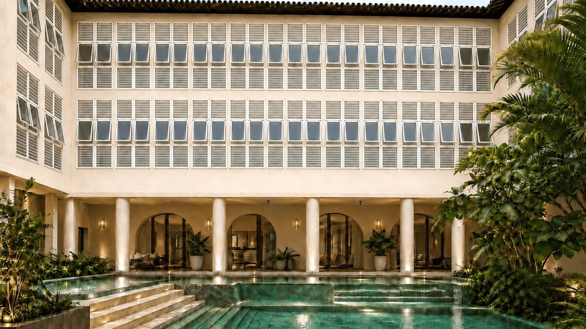 Render of the interior courtyard with a swimming pool and tropical vegetation at the Vila Galé Collection Ópera hotel in São Luís, Brazil.